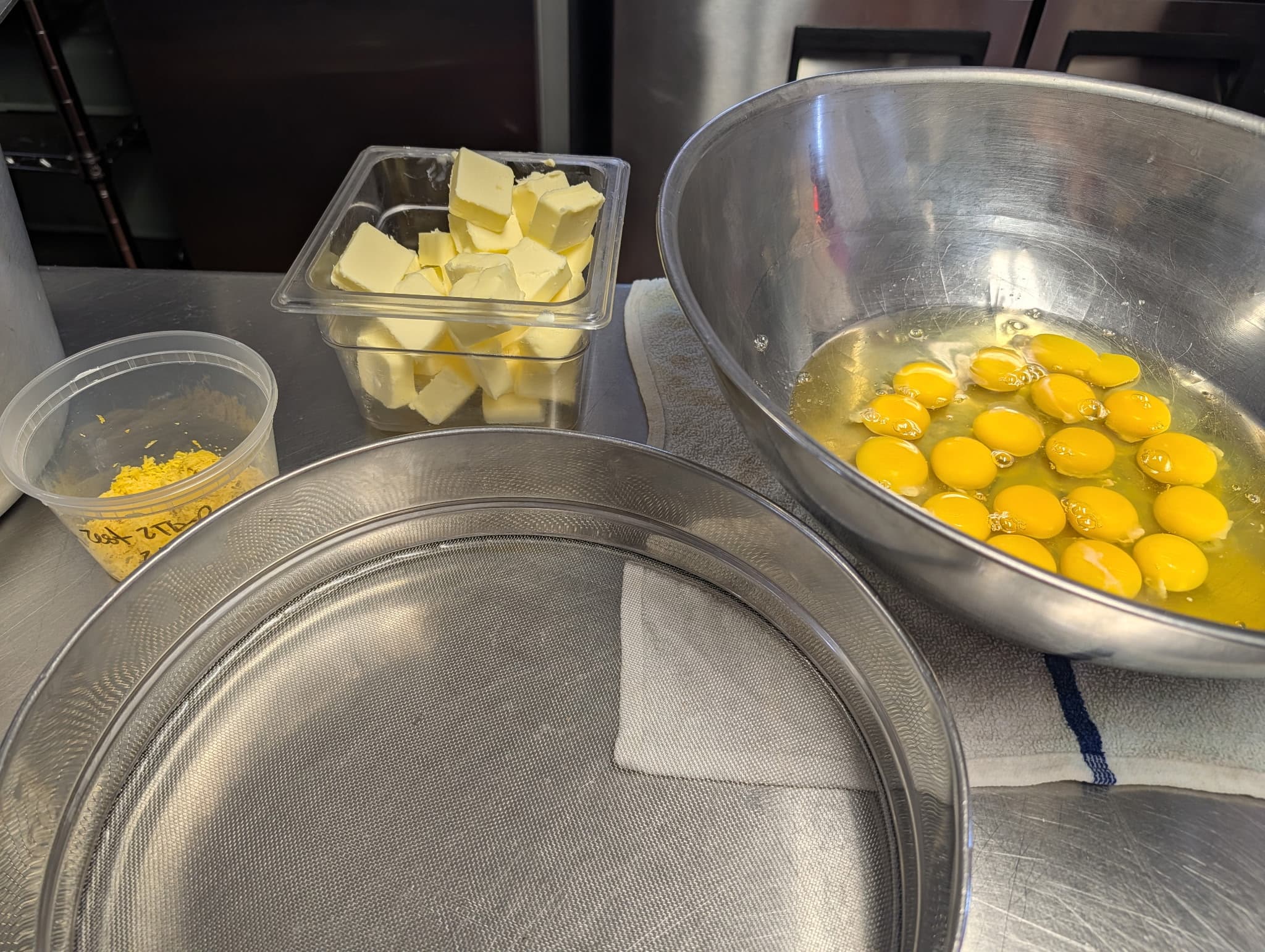 Homemade lemon curd ingredients arranged for an afternoon tea recipe