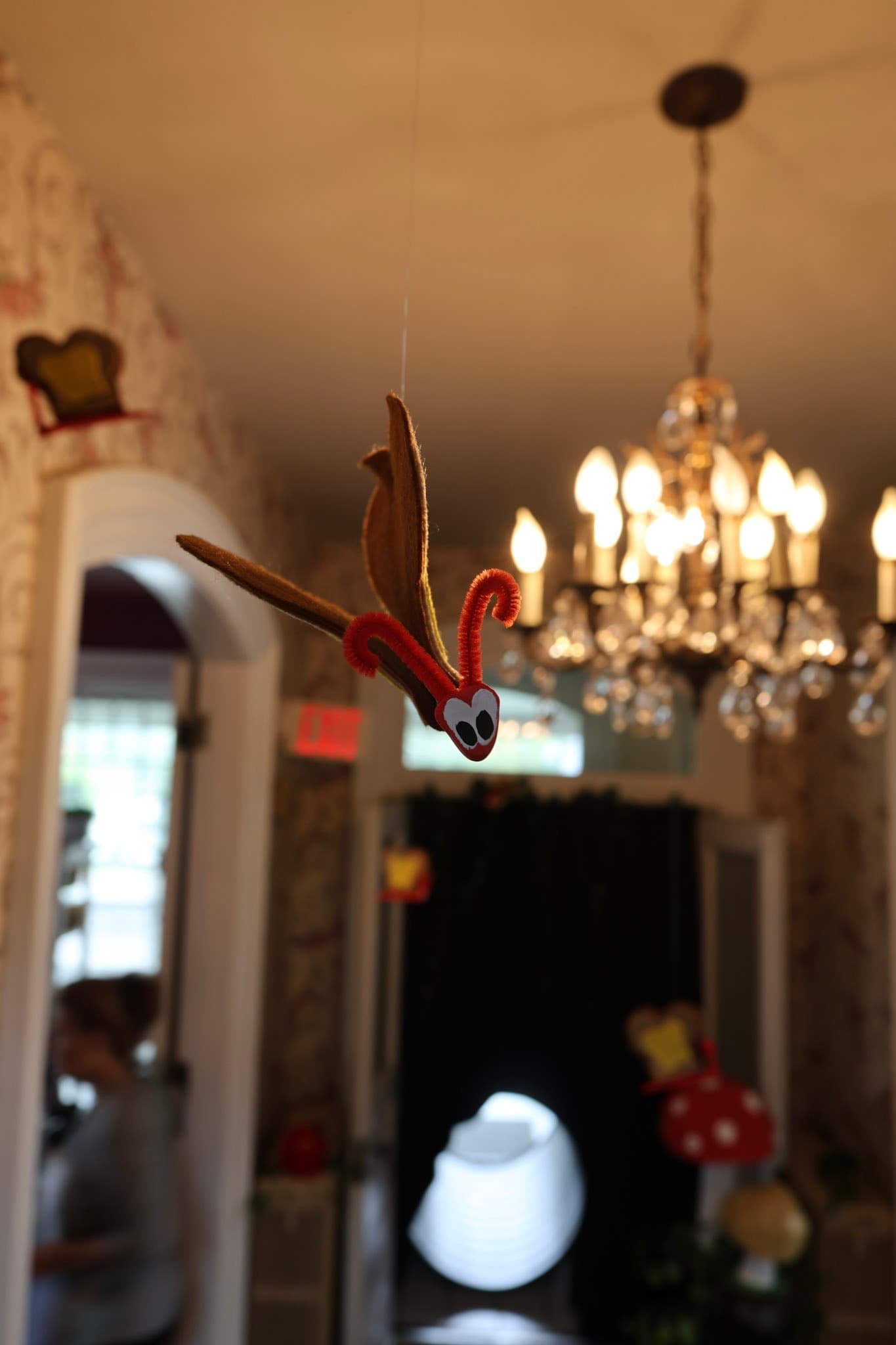 Handmade bread-and-butterfly hanging decoration in the hallway