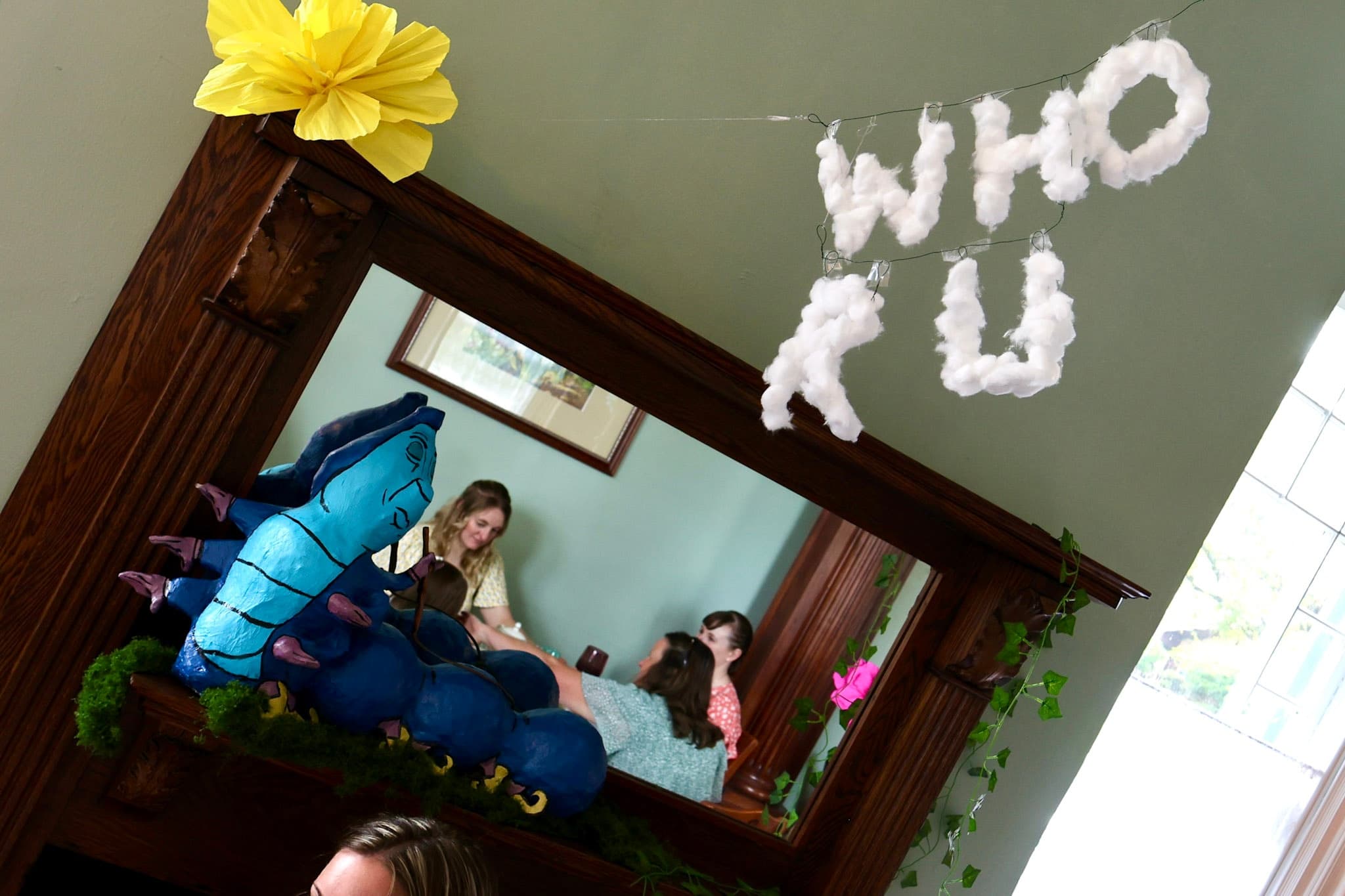 Blue Caterpillar mantelpiece with WHO R U smoke letters